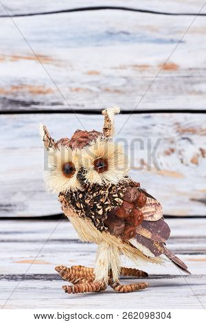 Cute Handmade Wooden Owl. Beautiful Owl Statue Made From Wood On Retro Wooden Background. Handicraft