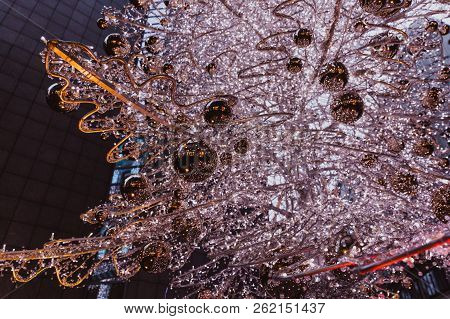 Budapest, Hungary - Glowing Christmas Tree And Tourists On The Busy Vaci Street, The Famous Shopping