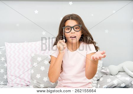 Slumber Party Photo Booth Props. Kid Girl Wondering Posing With Vintage Eyeglasses Party Attribute. 