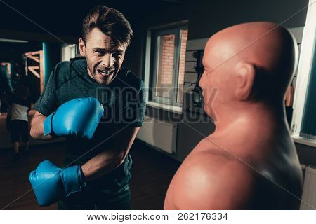 Man In Gym Is Training Shots With A Box Maneken. Sporty Male. Active Lifestyle. Boxing Gloves. Holid