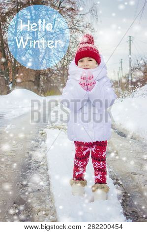 A Child Plays In The Snow In The Winter. Selective Focus.