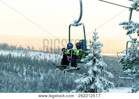 Ruka, Finland - November 27, 2012: Skiers Are Sitting On The Chair Ski Lift At Ruka Ski Resort In Fr