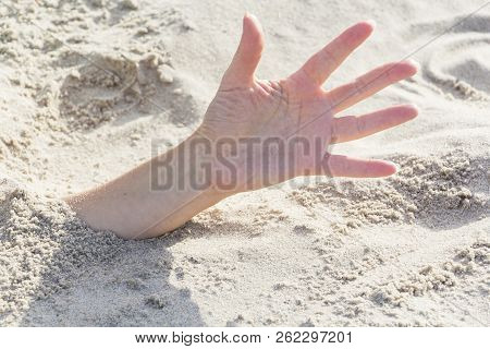Hand Closeup. Hands Buried In Sand On A Beach.