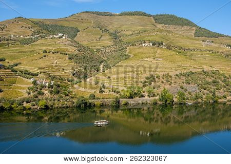 Peso Da Regua, Portugal - October 05, 2018 : Boat Carrying Tourists On The Douro River, Vila Real, P
