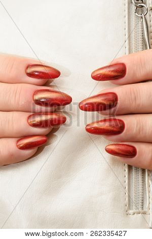 Manicure Gel Polish-red Cat Eye Nail Style On The White Background