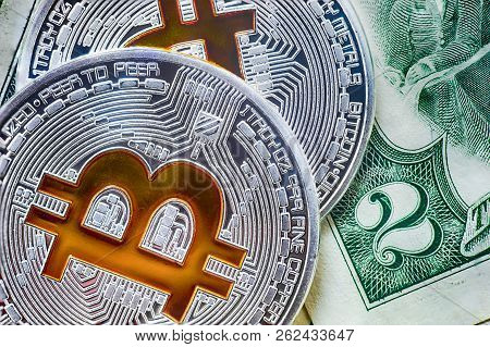 Symbolic Bitcoin Coins On A Rare Two Dollar Banknote. Exchange Bitcoin For Dollar.  Close Up Shot
