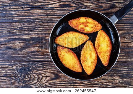 Delicious Fried Cornbread Pancakes - Chvishtari On A Skillet On An Old Rustic Table, Horizontal View
