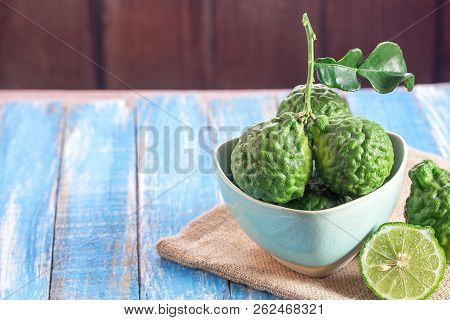 Cross Section Bergamot Or Bergamot Slice.close Up Bergamot On Wooden Table Background. With Some Jui
