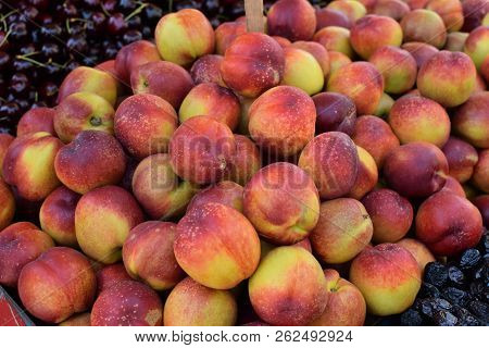 Pile Of Nectarines. Fresh Fruit At Grocery Shop.