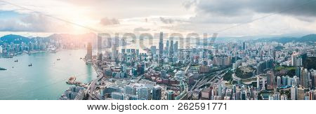 Top view aerial photo from flying drone of a HongKong Global City with development buildings, transportation, energy power infrastructure. Financial and business centers in developed China town