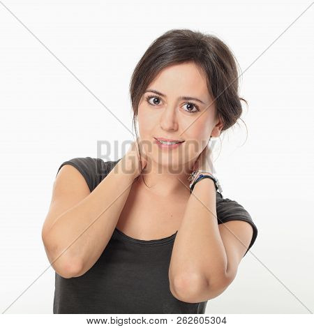 Young Nice Woman Posing With Holding Hands On Her Neck