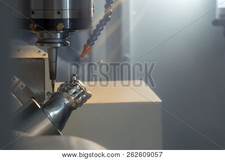 The 5-axis Cnc Milling Machine Cutting The Sample Part With The Solid Radius End-mill Tool .hi-techn