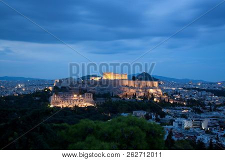 athens seen from Philopapou hill with views to Herodium , Acropolis and the Parthenon at blue hour, Attica, Greece