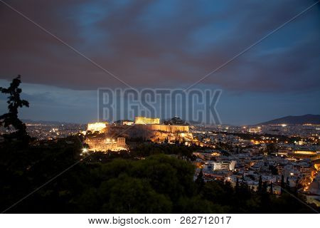athens seen from Philopapou hill with views to Herodium , Acropolis and the Parthenon at blue hour, Attica, Greece