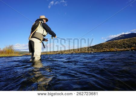 fly fisherman on Madisson river, Montana