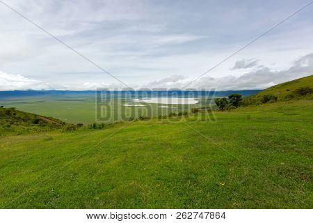Scenic view of seasonal salt lake, Lake Magadi, also called Makat, center of Ngorongoro Crater Conservation Area, view from edge of crater in Tanzania, East Africa 