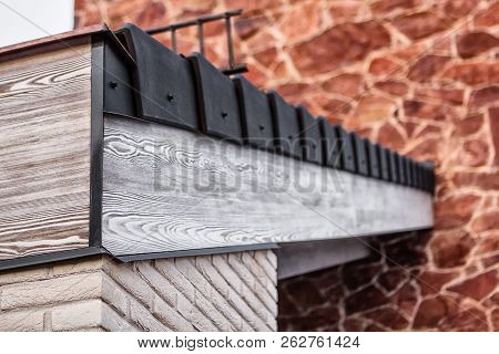 Roof Railing With Gray Wooden Beams, Black Tiles, White Brick Wall And Red Encaustic Sandstone