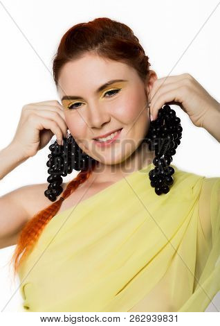 Beautiful Redhead Woman With Black Grapes. Concept Of Healthy Eating
