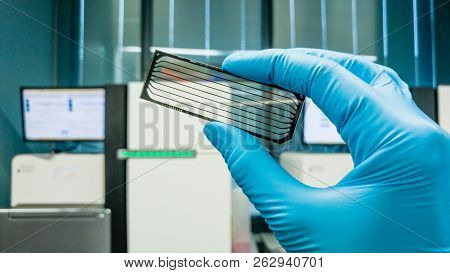 Frankfurt, Germany - July 27, 2017: Scientist With Dna Sequencing Chip. Medical Laboratory.