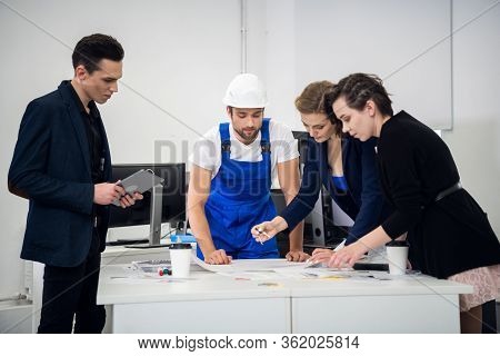 Architect Team Working With Compasses And Blueprints For Archite
