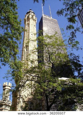 Chicago Water Tower and John Hancock Center. Low angle vertical view of the city's historic architecture and famous landmarks.