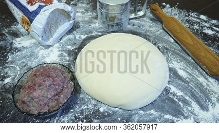 Meat Dumplings - Russian Pelmeni On Wooden Background
