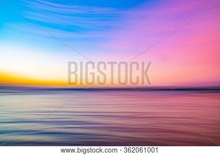Bright Background Of Accentuated Colors Of Sunset As Horizontal Motion Blur.
