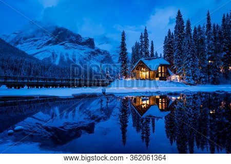 An Etherial View Of Emerald Lake Lodge With The Reflection In The Water During The Blue Hour In Brit