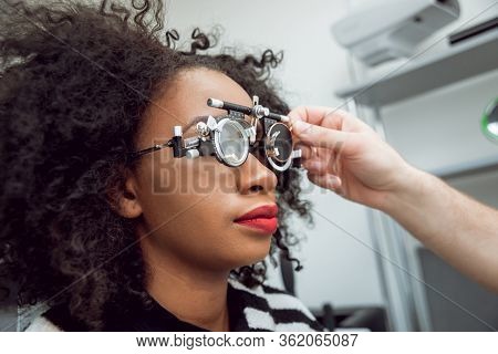 Consultation With An Ophthalmologist. Medical Equipment. Light Background.