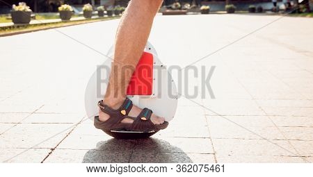 Young Man Driving On Solowheel In The Park.