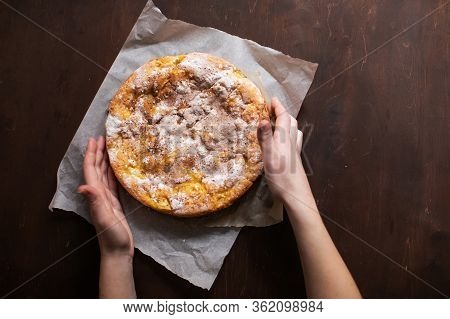 Woman Holds Fresh Pie With Apples And Cinnamon
