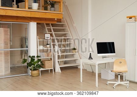 Background Image Of Contemporary Two Level Apartment Interior With Home Office Workplace In Foregrou