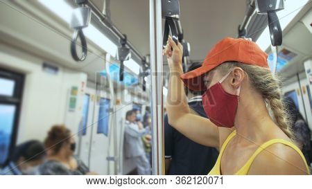 Woman Travel Caucasian Ride At Overground Train Airtrain With Wearing Protective Medical Mask. Girl 