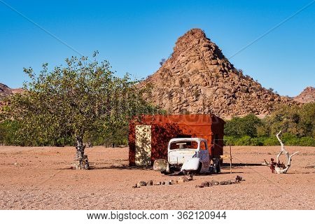 Twyfelfontein, Namibia - Jul 10, 2019: Wrecked Cars Lie Abandoned In The Desert Surrounding Twyfelfo