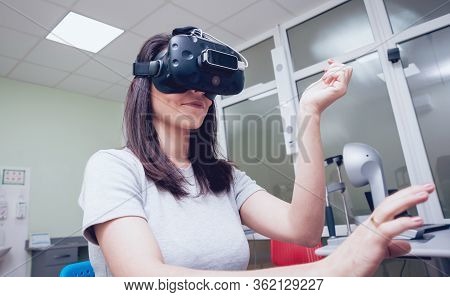 Eye Treatment. Patient In Virtual Reality Goggles.