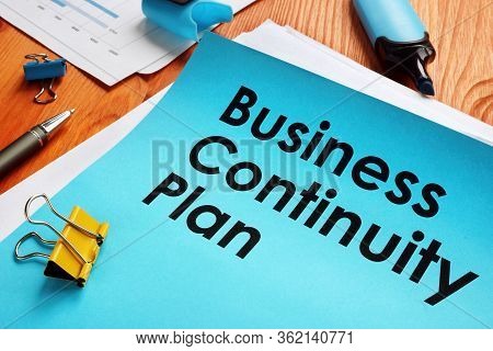Bcp Business Continuity Plan And Stack Of Papers.