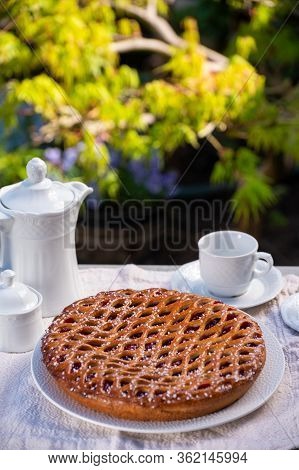 Cherry Pie With Dough Lattice From Limburg, Netherlands Served In Sunny Garden