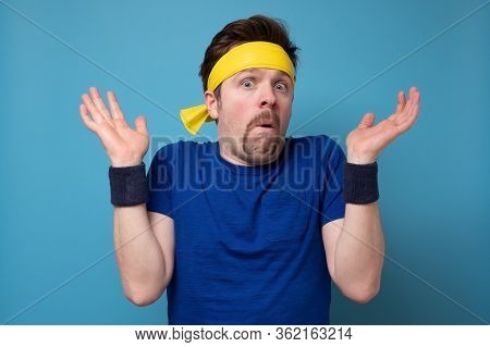 Young Man Wearing Sport Shirt Shocked With Surprise Expressio
