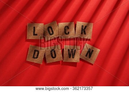 shadow on the word lock down on the red background