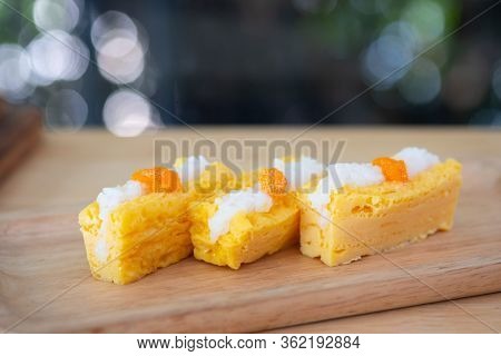 Close Up Of Grilled Tamago Sushi With Rice And Ebiko