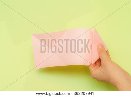 Origami Pink Heart On A Green Background, Step By Step Instructions. As Great Idea For A Hand Made D