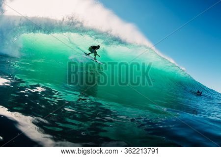 June 2, 2019. Bali, Indonesia. Surfer Ride On Barrel Wave. Professional Surfing At Padang Padang