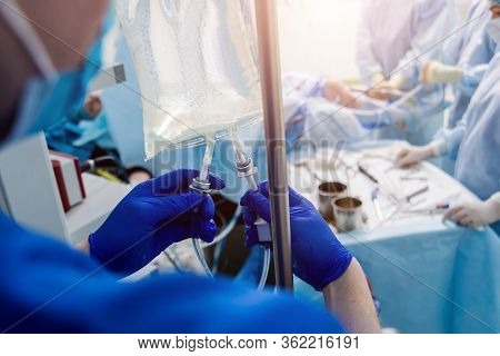 Arthroscope Surgery. Orthopedic Surgeons In Teamwork In The Operating Room