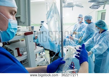 Arthroscope Surgery. Orthopedic Surgeons In Teamwork In The Operating Room