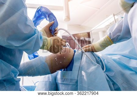 Arthroscope Surgery. Orthopedic Surgeons In Teamwork In The Operating Room