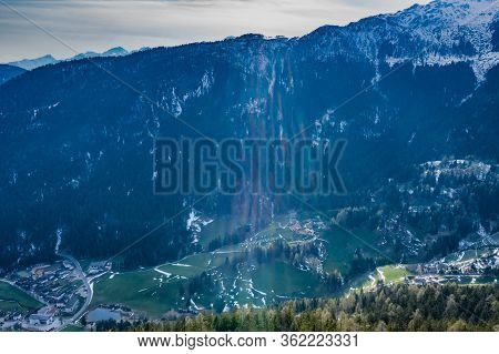 Aerial View Of Huge Valley Of The Mountains Of Italy, Trentino, Green Meadows, Slopes With Green Spr
