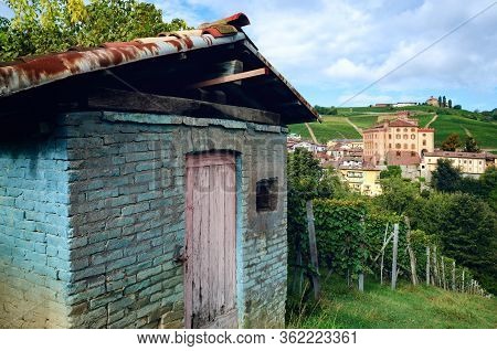 Panorama Of Barolo (piedmont, Italy) With The Town, The Medieval Castle And The Vineyards. Barolo Is