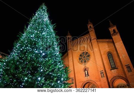 Piazza Risorgimento, Main Square Of Alba (piedmont, Italy) At Night With The Facade Of Saint Lawrenc