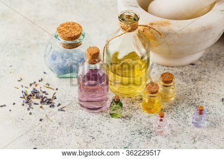 Aromatic Oils In Glass Bottles, Marble Mortar And Dry Lavender. Concept Natural Ogranic Skincare Cos