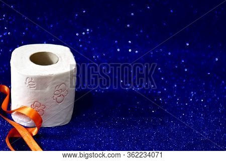 Roll Of Toilet Paper On Glitter Blue Background